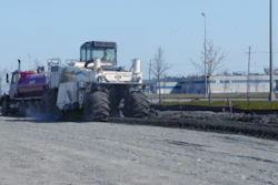 Midstate used a Wirtgen 2500 reclaimer to blend a cement additive and water with the soft soil to stabilize the parking area of the project.