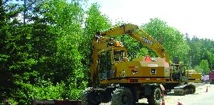 The Lane Construction Corp. uses wheeled excavators for added mobility and ease of travel.