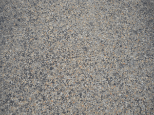 A close-up of the highway's three-course surface treatment that included the use of CRS-2P, a cationic rapid setting type of emulsified asphalt modified with the addition of polymers, and expanded clay lightweight aggregate (LWA).