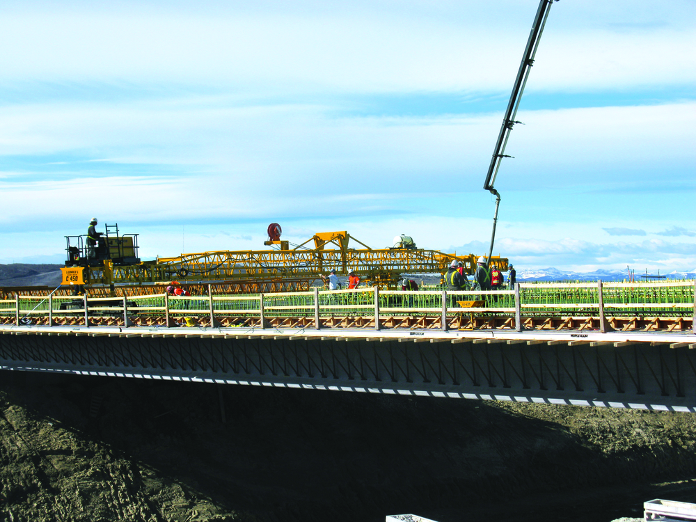 Graham Group Ltd.’s new GOMACO C-450 finisher with transitional framework was put to work right away on Highway 2 just north of Calgary. The project involved placement of 620 cu. yds. of silica-fume concrete on side-by-side bridges.