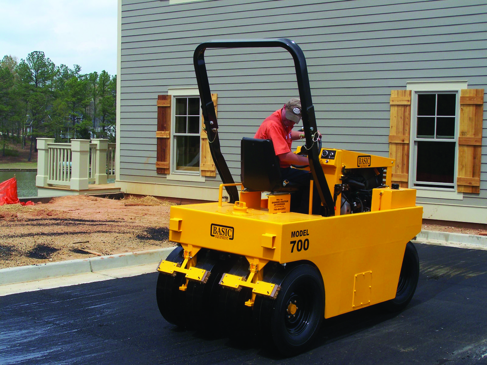 When completing chipseal projects, pneumatic rollers will set the aggregate in the oil without breaking the edges of the rock. Courtesy Basic Equipment, www.basicequipment.net.