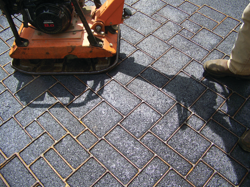 Thermotrack’s Hot Print wire rope templates are embedded into the heated asphalt by a plate compacter, then removed leaving the design impression.