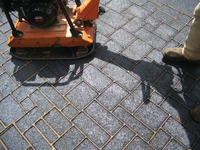Thermotrack’s Hot Print wire rope templates are embedded into the heated asphalt by a plate compacter, then removed leaving the design impression.