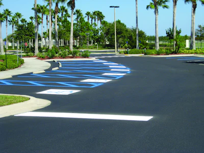 Because it was a government job, Robert had to restripe the handicap stalls exactly as they were with several different designs on each parking lot. Photo documentation was used to ensure proper painting.