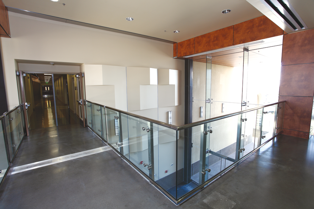 At Miramar College, Surfacing Solutions polished 9,000 square feet of floors, including this second floor area. Crews had to use a lift to get grinders through a framed window because elevators were not working.
