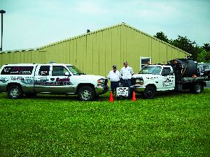 Chuck Wallace (left) and his son Dan transformed a weekend sealcoating business into a full-time operation that regularly handled jobs of 100,000 sq. ft. before stepping up to bigger projects.