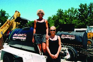 Pam Darst (left) and daughter Nichole Darst before they head out sealcoating.