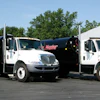Two custom-built 2,250-gal. sealcoating rigs installed in new International 4300 trucks each feature SealMaster's Pro Air series of spray systems, cab-operated spray bars, and 50-gal. water systems.