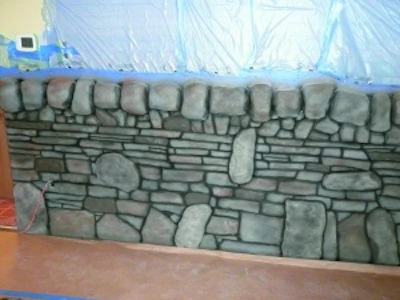 Foam and stampable vertical overlay were used to create a stone wall at the Irish pub.