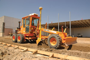 Attachments and automated grade control systems can increase both precision and utilization.