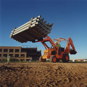 Smaller tractor-loader-backhoes feature increased engine and hydraulic power, enabling them to handle the more rugged applications encountered on commercial construction projects.