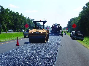 The compaction effort should start immediately after the ultrathin bonded wearing material is laid.