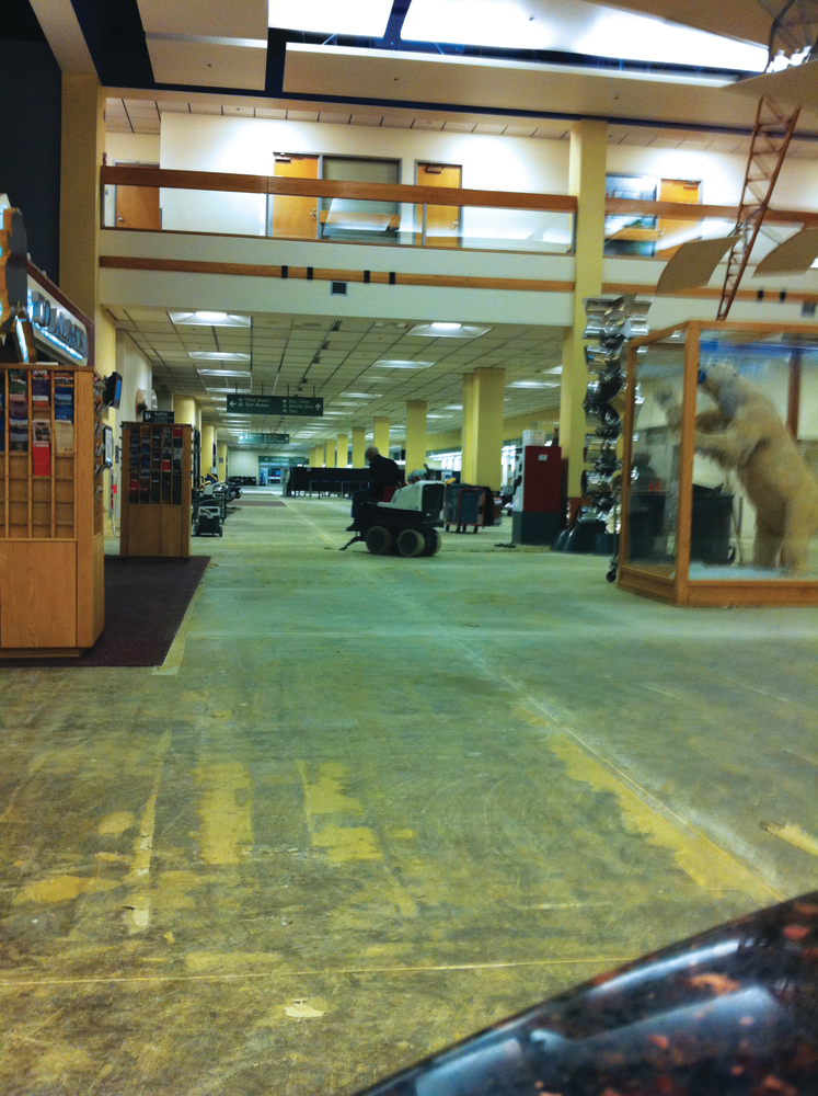 Grand Prospect crews prepped the floor at the Anchorage airport with a ride-on grinder, removing decades of former floor covering adhesives.