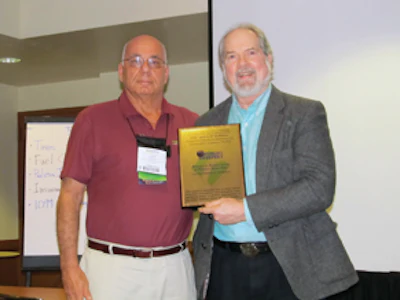 John Dubbioso, left, recipient of the Award of Excellence in Power Sweeping and Ranger Kidwell-Ross, right, editor of WorldSweeping.com.