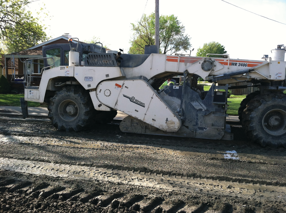 After milling off 3-4 inches of the existing surface, Midwest Stabilization used a Wirtgen 2400 reclaimer to till the cement into the surface.