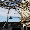 The dome's roofing materials - a compilation of over 16 inches of lightweight concrete, foam insulation, built-up roofing material and thin copper sheeting - were removed manually.