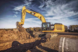 Schlouch Inc. negotiated the purchase of a Caterpillar 336E Hybrid (such as shown) from Giles & Ransome with a performance guarantee based on fuel economy. It halved fuel costs for pipelaying, and Schlouch rented two more with purchase options.