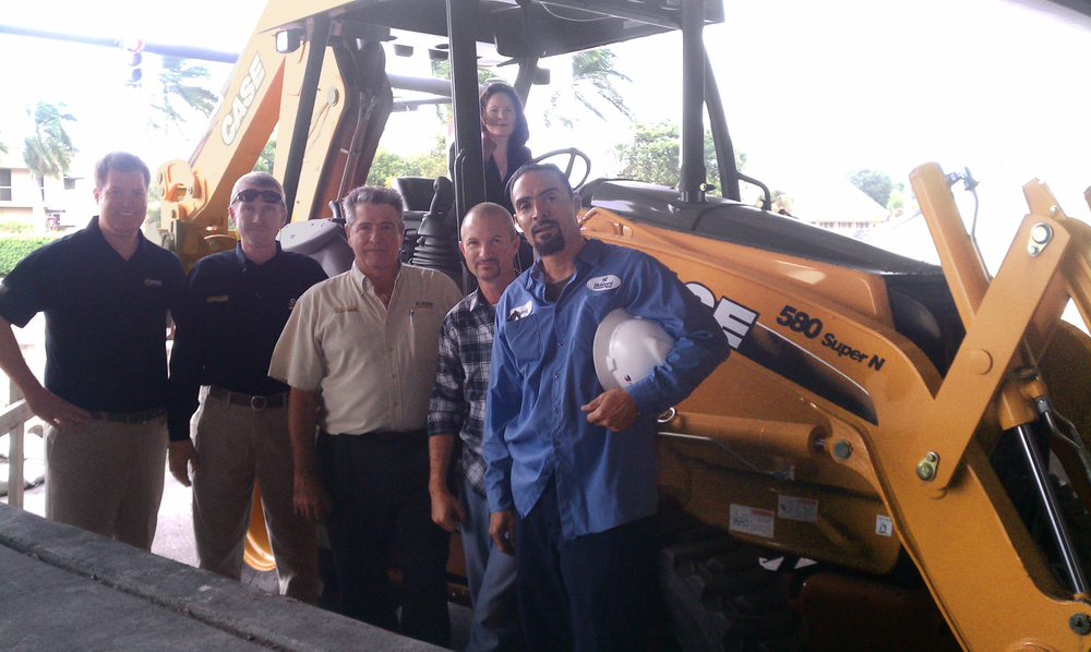 Case Community Challenge grand prize winner, Hubbard Construction received one year's free use of a Case 580N loader/backhoe. Pictured from left to right are Jim Bansen, Case territory sales manager; David Moore and Bob Ramos, Trekker Tractor; James Ankrum, Jr., Freddy Cruz and Gregoria Estrella (seated on the loader/backhoe), Hubbard Construction Company.