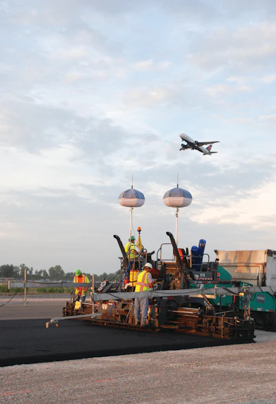 Two Vogele Vision 5200-2 asphalt pavers were used in 24- to 27-ft.-wide passes at the Port Columbus International Airport..