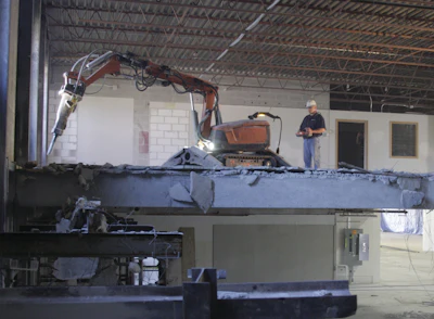 Husqvarna is moving in the direction of selling robots to demolish concrete, separating workers from exposure to vibration issues. Workers stand away from the machine and use joysticks to control the robot's movement.