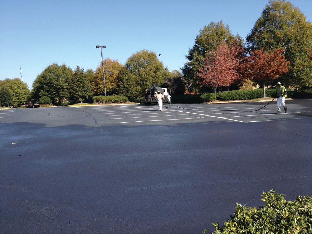 Owner Gerry Signs says that despite the weather the crews were able to complete sealcoating areas quickly enough so there was enough time for the sealer to dry between coats.