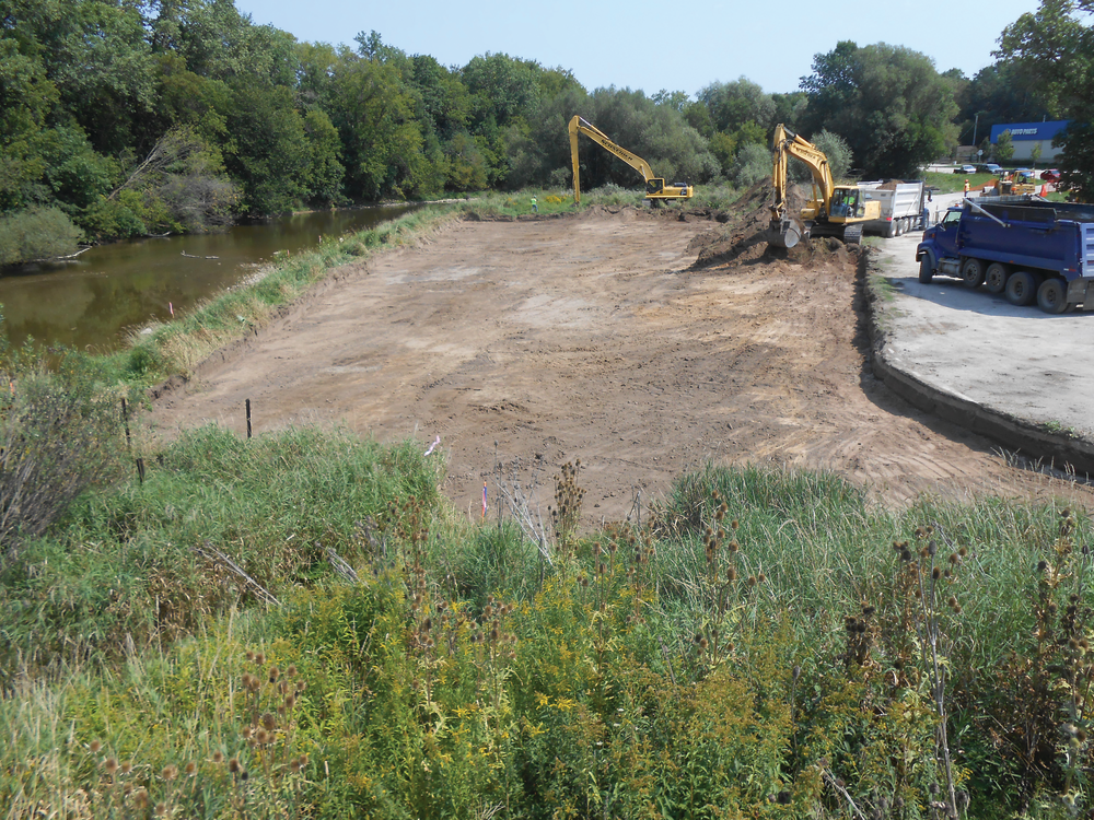 Schneider Excavating, Inc. was hired to excavate the plants and provide a finished grade suitable for replanting on the Sheboygan River riverbank in Wisconsin.