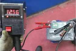 When the tester's clamps are placed on the battery, it automatically displays the battery's voltage.