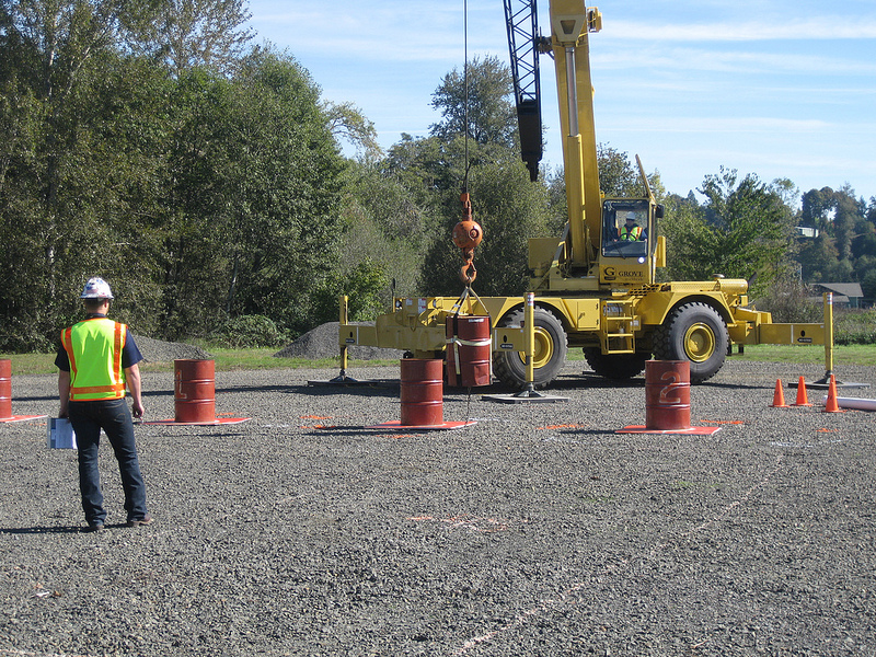 Crane Operator Skills Championship contestant navigates a suspended barrel through the Barrel Slalom at a qualifying event for the 2014 championship.