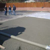 Finishing the pervious concrete was done with roller-screed strike-off, covered with plastic and rolled, and then received a plastic cover cure.