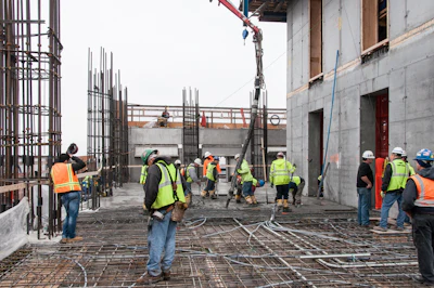 With the core structure on the right and the exterior columns and spandrels on the left of the photo, the 10' thick 'flat plate' floors act as a diaphragm, joining the two vertical elements together.