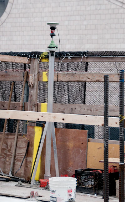 The GPS surveying instrument shown here allows engineers to layout horizontal and vertical geometry for the building even if the structure is moving back and forth.