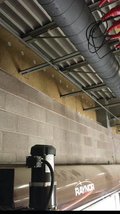 Garage door coils of the Vehicle Maintenance facility 45 feet off the ground prevented use of a scissors lift.