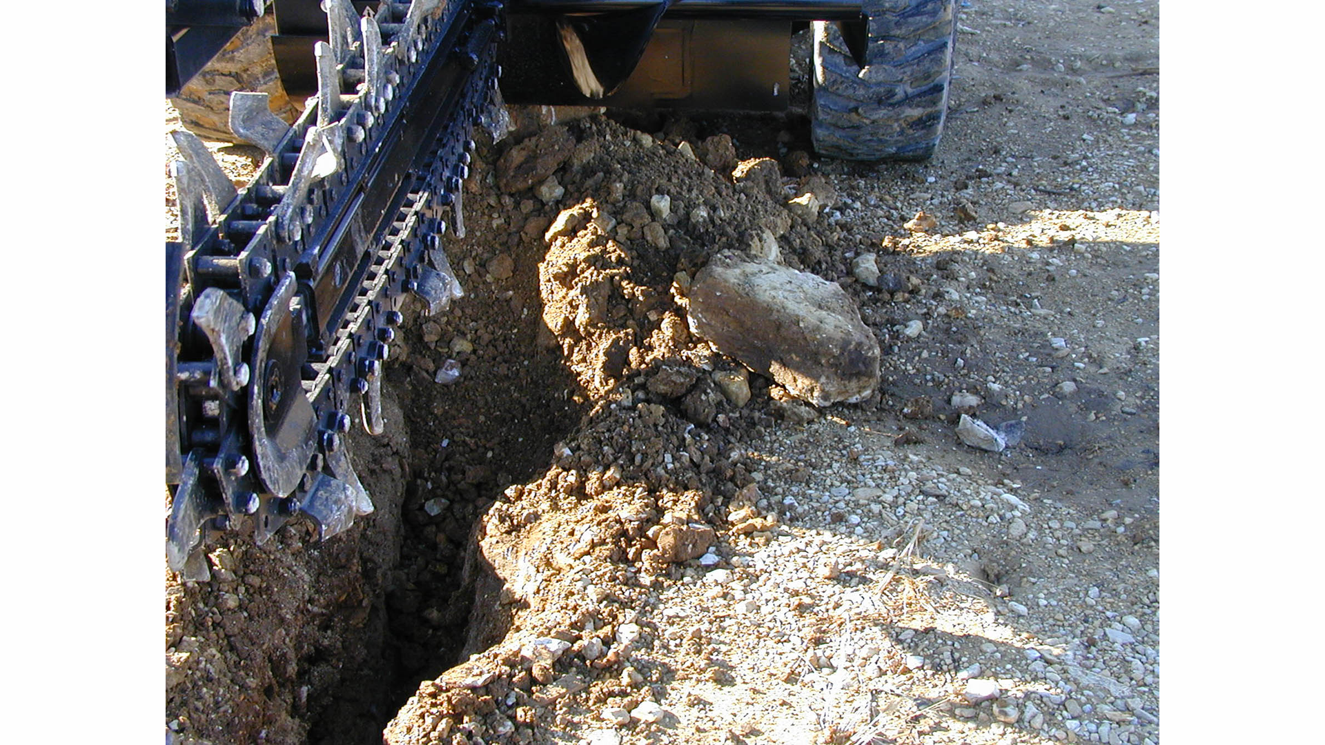 Before your trencher attachment touches the dirt, match the tooth type and pattern with your soil type.