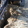 Before your trencher attachment touches the dirt, match the tooth type and pattern with your soil type.