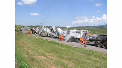 The roadwork train consisted of a water truck in front, emulsion tanker truck, Roadtec RX-900e cold planer, Roadtec RT-500 mobile recycle trailer, a Caterpillar paver, a Cat steel roller compactor and a Cat rubber tire compactor.