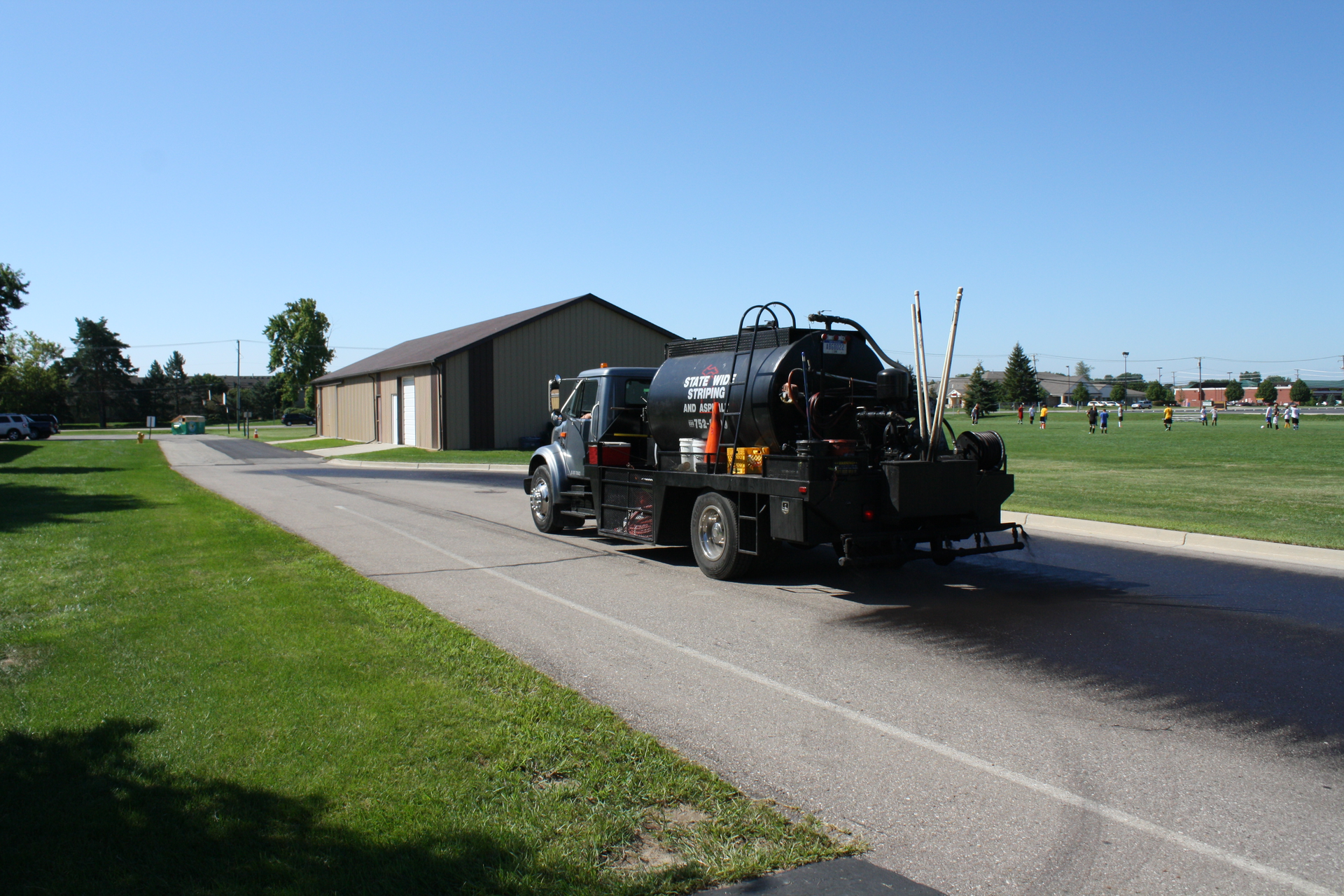 “Just as paint can protect wood and metal from the elements, sealer protects asphalt,” says GemSeal’s Lee Lowis. “It also helps to keep the pavement flexible by sealing in the asphalt oils.”