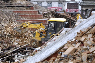 A JCB backhoe is pictured at work on April 28, 2015, in the earthquake disaster area in Kathmandu, Nepal.