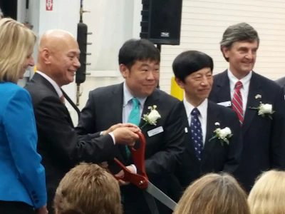Participants in the grand opening presentation and official ribbon cutting ceremony included (from left to right): Jennifer Noel Fletcher, South Carolina Deputy Secretary of Commerce; Kazuhide Naraki, president & CEO, Kobelco Construction Machinery Company; Pete Morita, president & CEO, Kobelco Construction Machinery USA, Inc.; The Honorable Takashi Shinozuka, Consulate General of Japan; and David Britt, chairman of the Spartanburg County Council/Economic Development Committee.