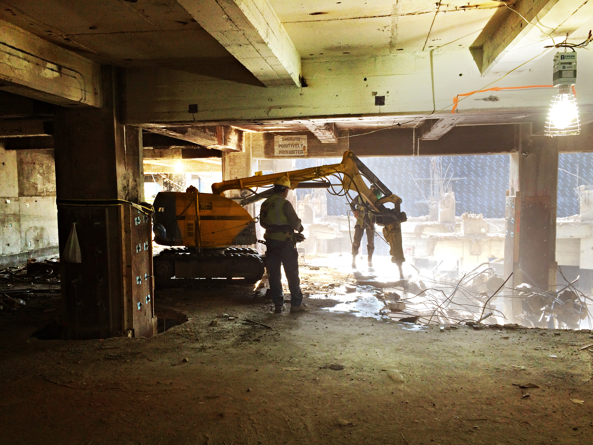 Two 6,700-lb. Brokk 260s with hydraulic breaker attachments were used to remove the warehouse's reinforced floors.