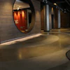 The PolishedCrete team working with Jett Landscape Architecture + Design created a whimsical graphic that resembles a “swirl” effect within the polished concrete surface.