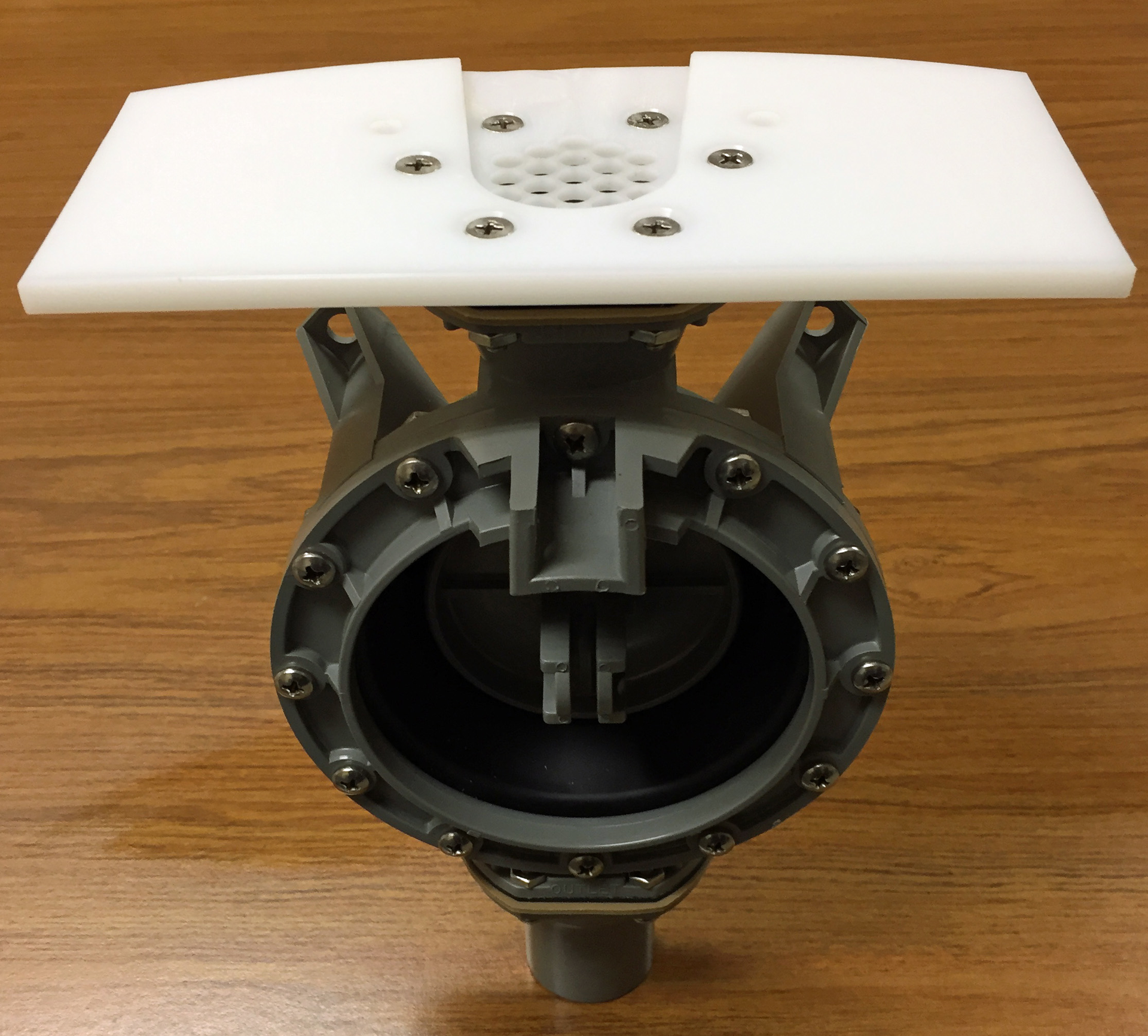 Guzzler pump plate mounted on a pump.