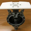 Guzzler pump plate mounted on a pump.