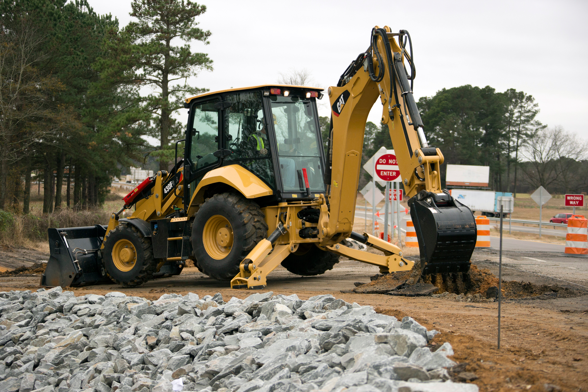 Caterpillar makes pilot controls with pattern changer available even on its entry-level machines. This makes it easier for operators to switch back and forth between excavator and backhoe operation.