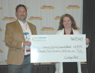 Phillips presented a $2,500 check on behalf of the 1-800-Sweeper foundation to help rebuild Gatlinburg after the fires.