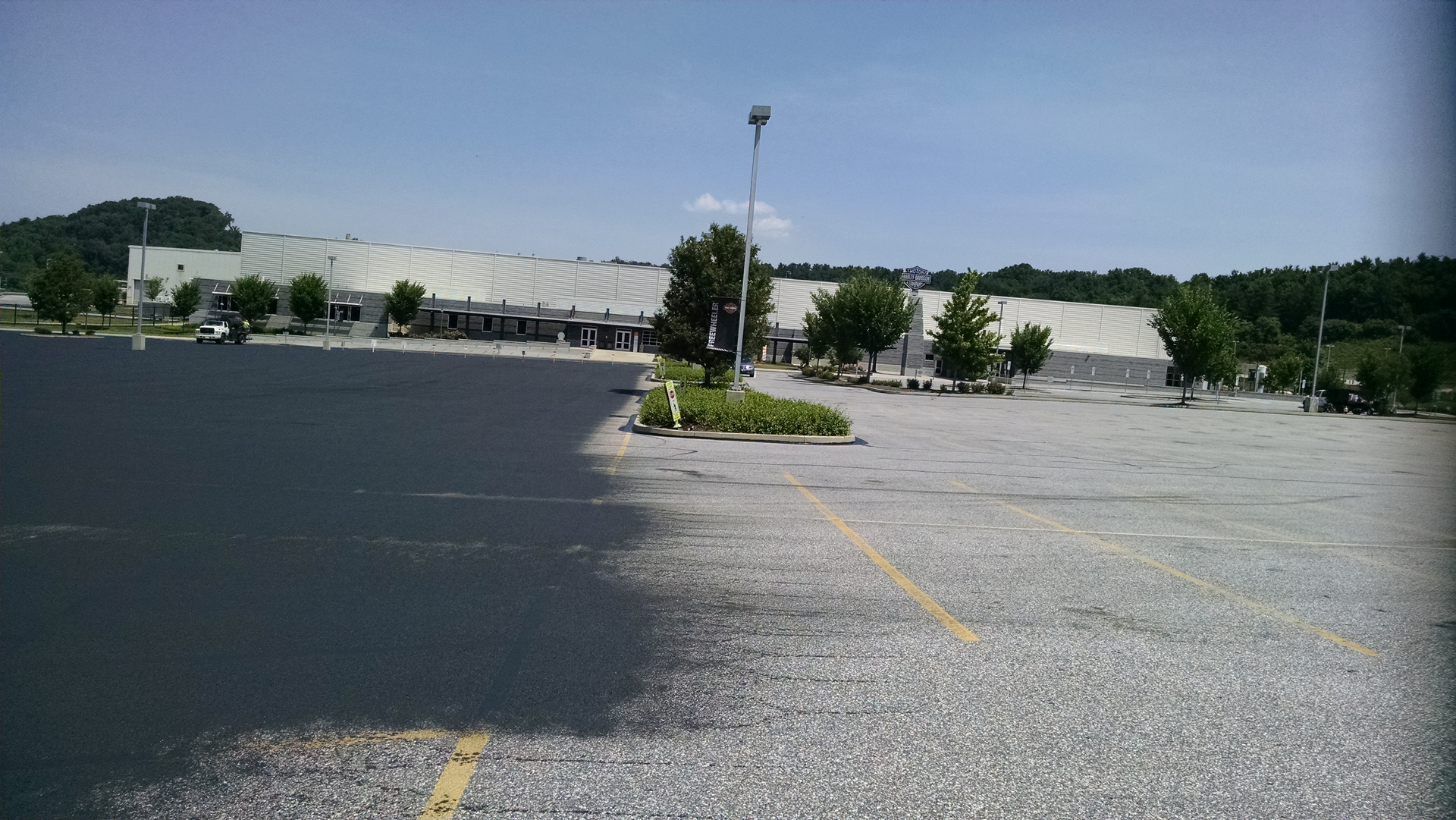 The first step was cleaning the pavement using walk-behind blowers, brooms and sweeping equipment. That was followed by cracksealing and the first coat of sealer.