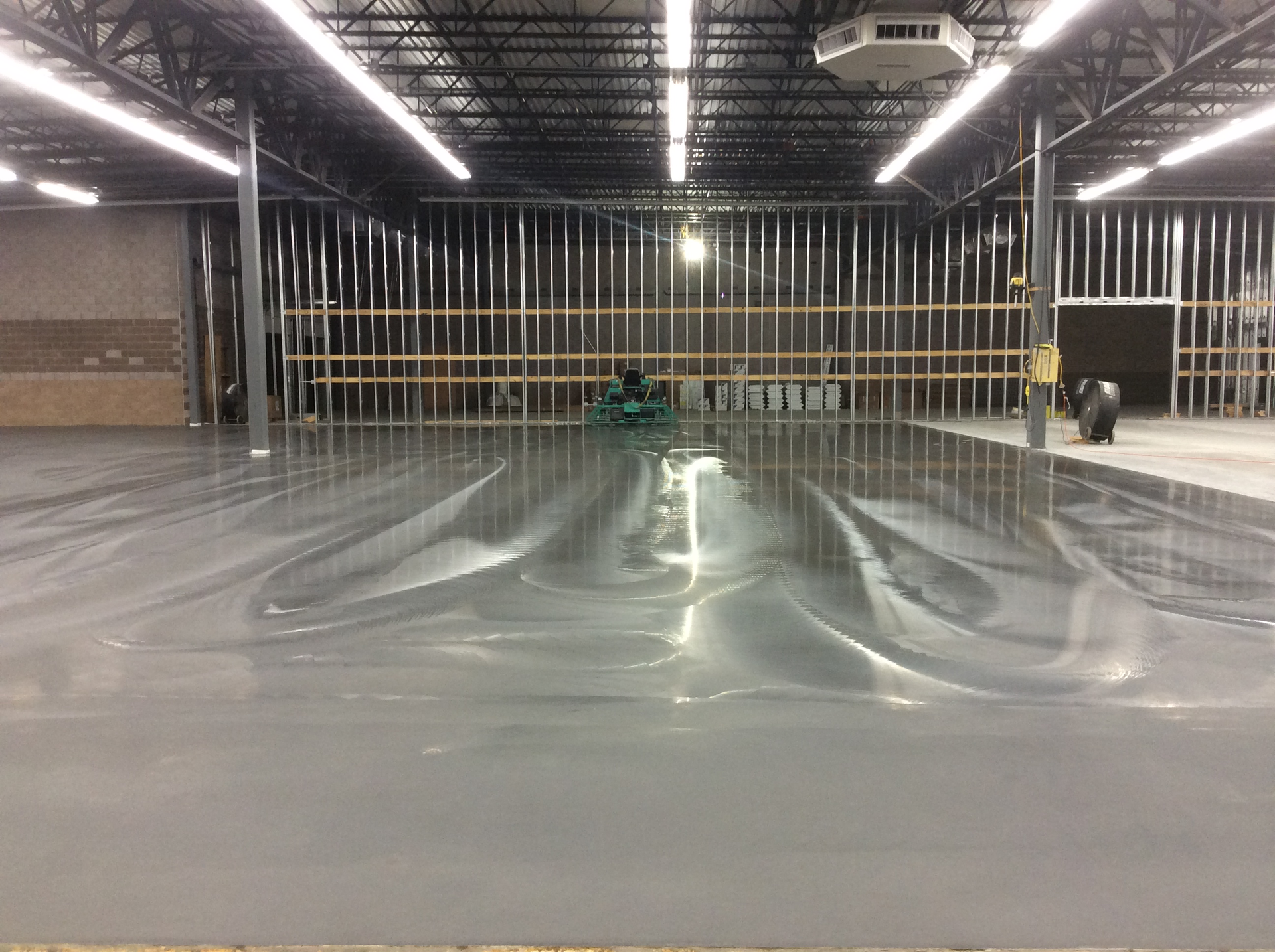 Unvented heating can cause serious problems to fresh concrete. This nicely finished floor carbonated within the first couple days, causing the surface to pull up when tape was removed.