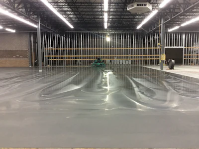 Unvented heating can cause serious problems to fresh concrete. This nicely finished floor carbonated within the first couple days, causing the surface to pull up when tape was removed.