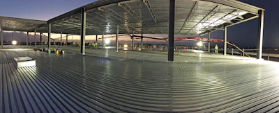 A Putzmeister boom pump and Telebelt® conveyor teamed up to place concrete for more than 25 slab pours under extremely low heights.