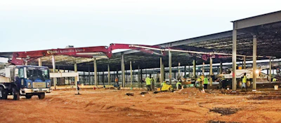 A Putzmeister boom pump and Telebelt® conveyor teamed up to place concrete for more than 25 slab pours under extremely low heights.