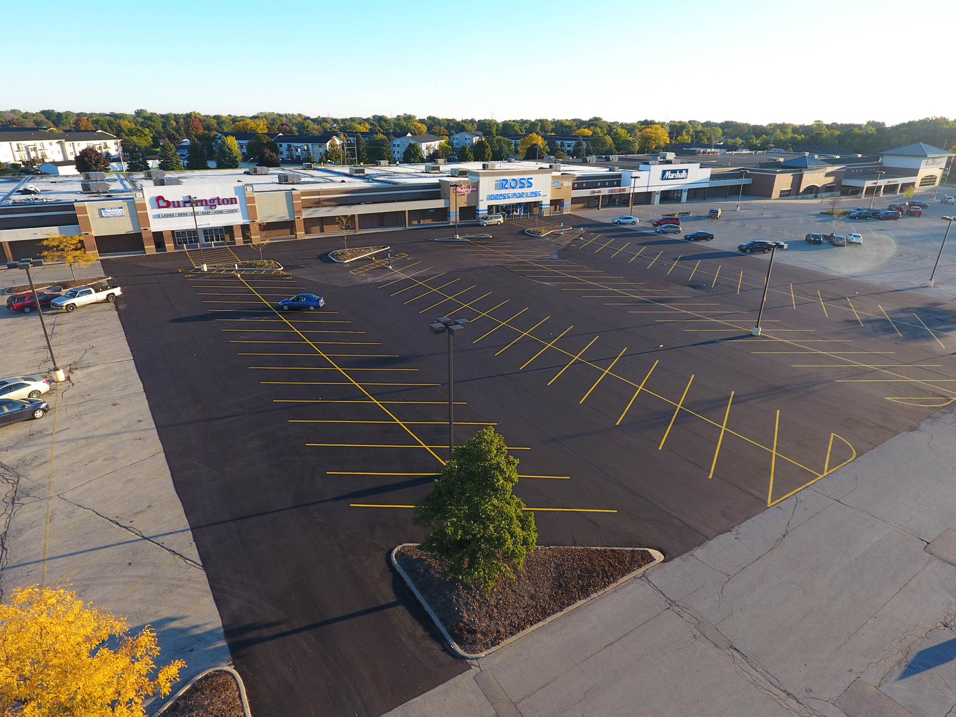 Initially the job was a mill and fill project. Asphalt Contractors had intended to just do a small patch but the inspector read the plans and determined the entire parking lot had to be milled, paved and striped before the stores could open.